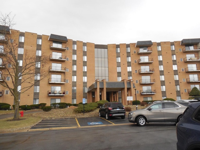 900 W Sunset Dr Unit 505, Glenwood, IL 60425 - view of building exterior featuring uncovered parking