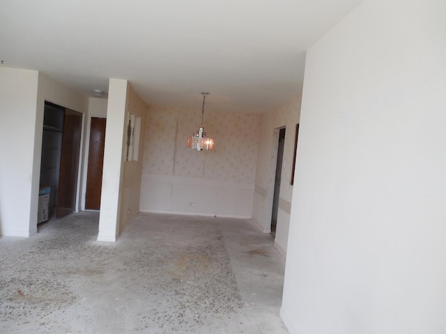 900 W Sunset Dr Unit 505, Glenwood, IL 60425 - unfurnished dining area featuring wallpapered walls and an inviting chandelier