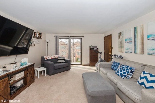 living area featuring light carpet