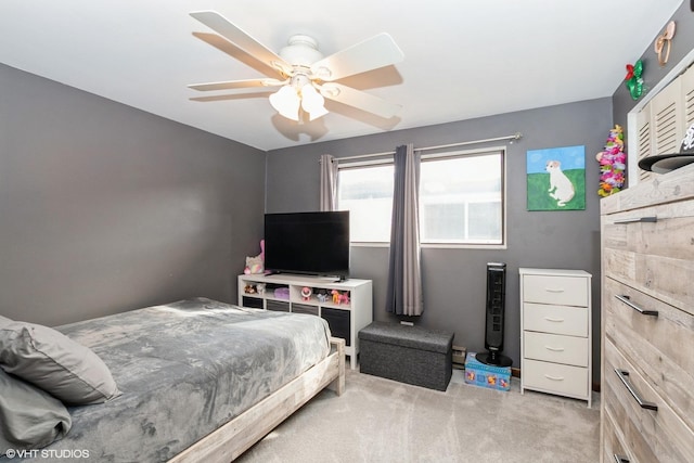 bedroom featuring ceiling fan and light carpet