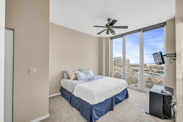 1600 S Indiana Ave Unit 1107, Chicago, IL 60616 - carpeted bedroom with a ceiling fan, baseboards, and expansive windows