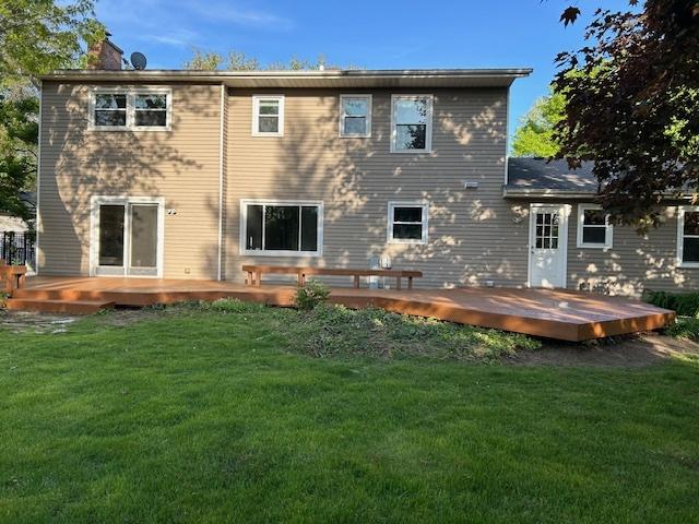 986 Rossmere Ct, Naperville, IL 60540 - back of house featuring a wooden deck, a chimney, and a lawn