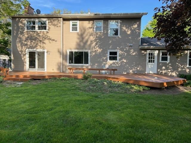 986 Rossmere Ct, Naperville, IL 60540 - back of house featuring a wooden deck, a yard, and a chimney