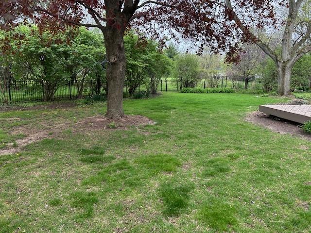 view of yard featuring a fenced backyard and a wooden deck
