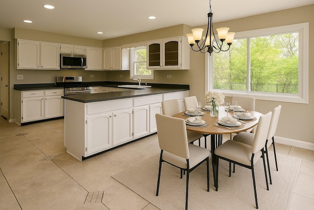 986 Rossmere Ct, Naperville, IL 60540 - kitchen featuring stainless steel appliances, dark countertops, white cabinetry, and recessed lighting