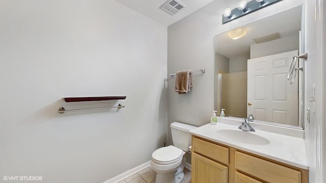 400 W Ontario St Unit 606, Chicago, IL 60654 - bathroom with visible vents, baseboards, toilet, vanity, and tile patterned floors