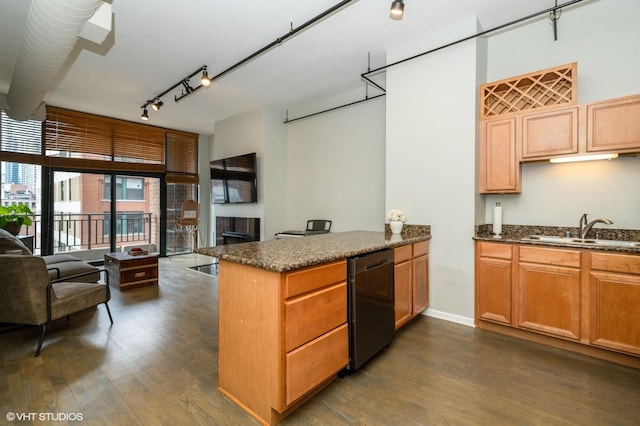 400 W Ontario St Unit 606, Chicago, IL 60654 - kitchen with black dishwasher, a sink, open floor plan, a peninsula, and dark wood-style floors