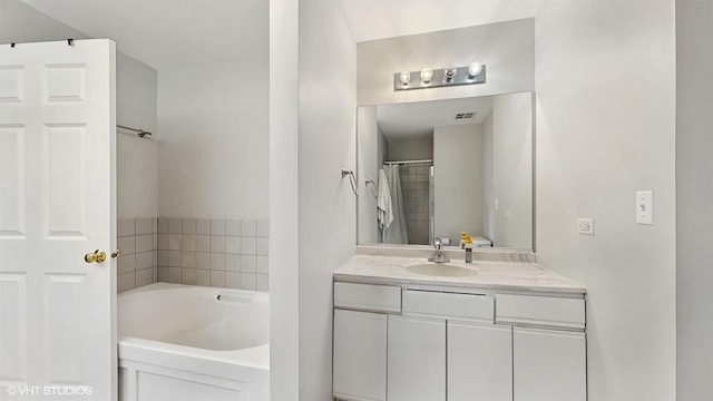 400 W Ontario St Unit 606, Chicago, IL 60654 - bathroom with vanity, visible vents, and a garden tub