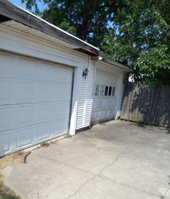 garage with fence