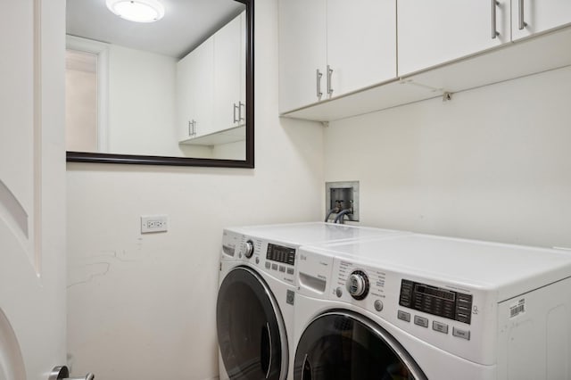 laundry room with cabinet space and washing machine and dryer