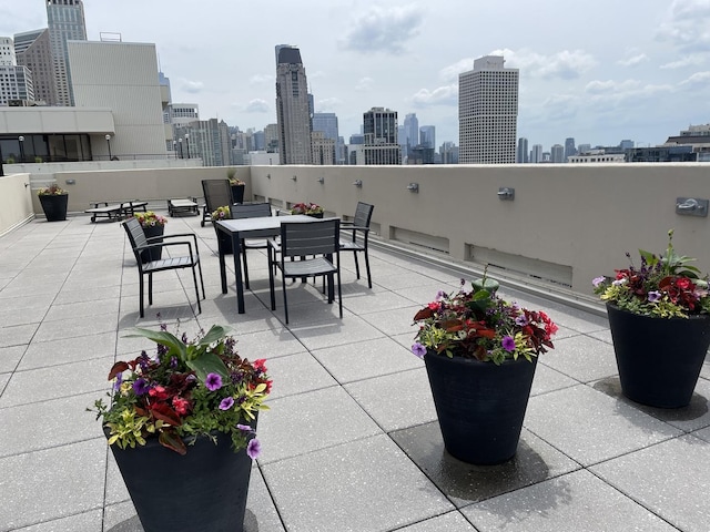 view of patio / terrace featuring a city view