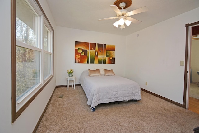 bedroom with baseboards, visible vents, and carpet floors