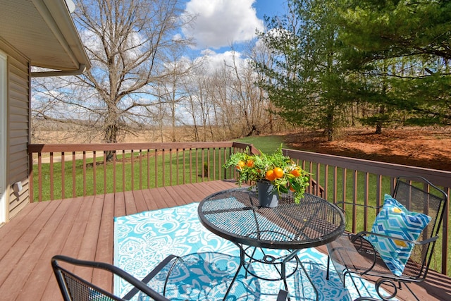 wooden deck with a yard