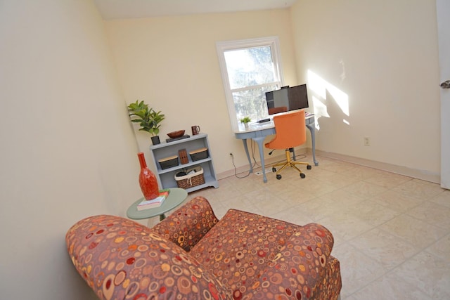 tiled home office featuring baseboards