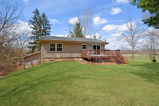 rear view of property featuring a deck and a yard