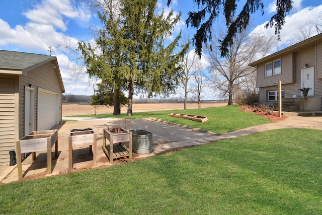 view of yard with a garage