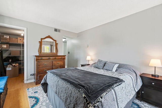 326 Park Ave Unit 38, Clarendon Hills, IL 60514 - bedroom with a walk in closet, light wood finished floors, and a closet
