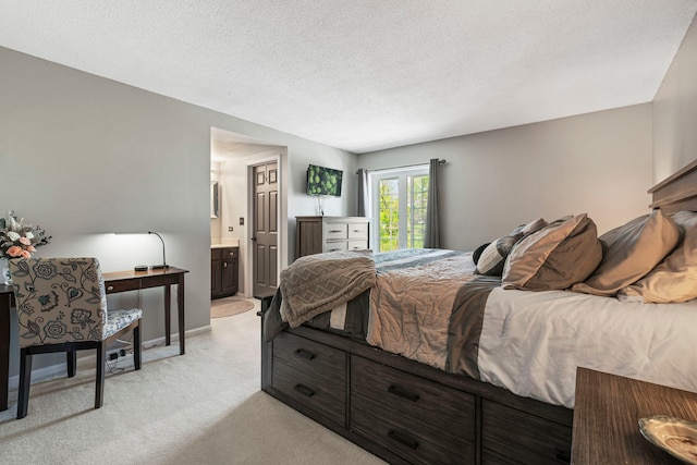 326 Park Ave Unit 38, Clarendon Hills, IL 60514 - bedroom with light carpet, a textured ceiling, and connected bathroom