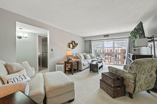 326 Park Ave Unit 38, Clarendon Hills, IL 60514 - carpeted living area featuring a textured ceiling
