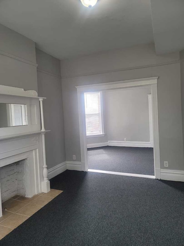 6506 S Eberhart Ave, Chicago, IL 60637 - unfurnished living room featuring a fireplace with flush hearth and baseboards