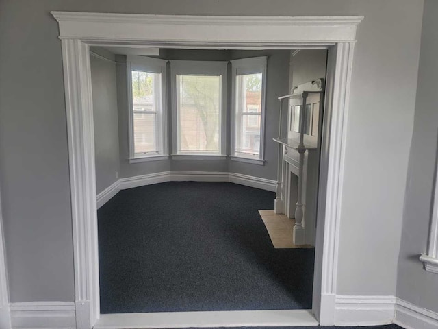 6506 S Eberhart Ave, Chicago, IL 60637 - unfurnished living room with baseboards and a wealth of natural light