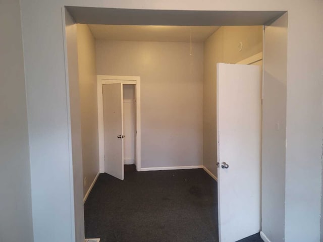 6506 S Eberhart Ave, Chicago, IL 60637 - hallway with dark colored carpet and baseboards