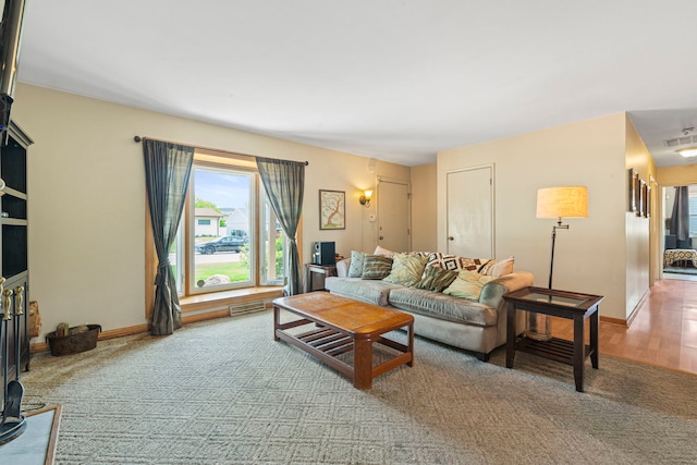 living room with carpet floors and baseboards