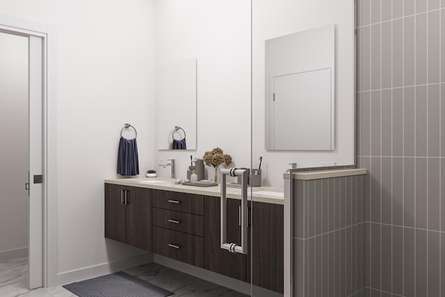 5114 S Kenwood Ave Unit 3B, Chicago, IL 60615 - bathroom with marble look tile flooring, double vanity, and baseboards