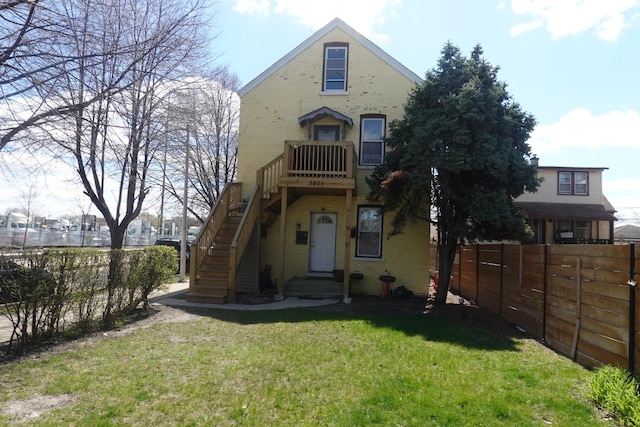 3801 W 46th St, Chicago, IL 60632 - view of front of property with stairway, fence, and a front yard