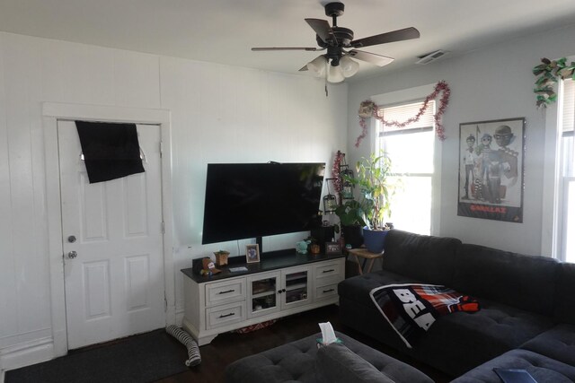 3801 W 46th St, Chicago, IL 60632 - living room featuring ceiling fan, dark wood finished floors, and visible vents