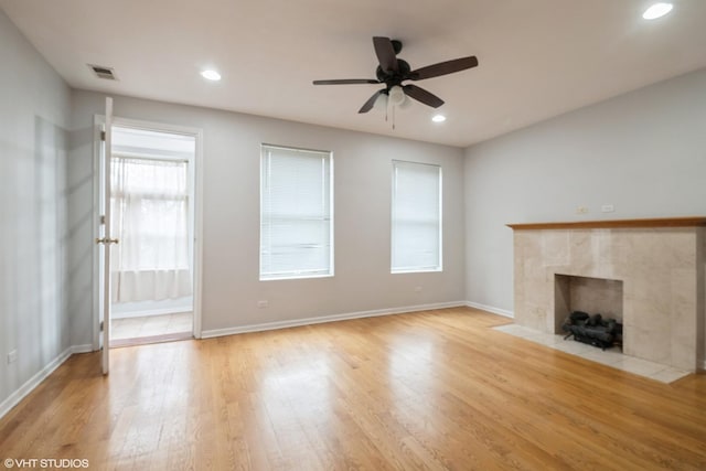 1516 E Marquette Rd Unit 2E, Chicago, IL 60637 - unfurnished living room with a ceiling fan, baseboards, visible vents, a fireplace, and light wood-type flooring