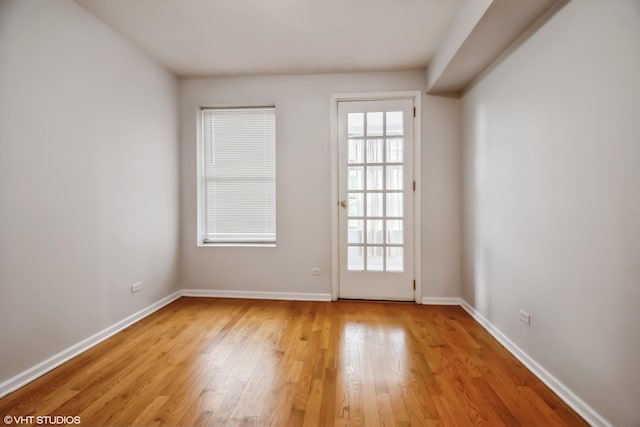 1516 E Marquette Rd Unit 2E, Chicago, IL 60637 - unfurnished room featuring baseboards and light wood-style floors