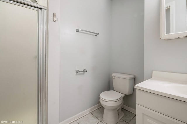 1516 E Marquette Rd Unit 2E, Chicago, IL 60637 - bathroom with toilet, baseboards, tile patterned floors, and vanity