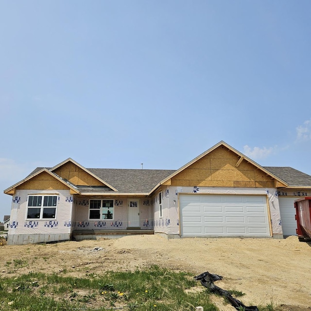 12616 New York St, Loves Park, IL 61111 - property in mid-construction with a garage, driveway, a porch, and roof with shingles