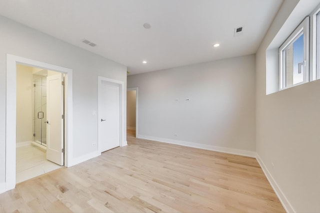 spare room with recessed lighting, visible vents, baseboards, and light wood-type flooring