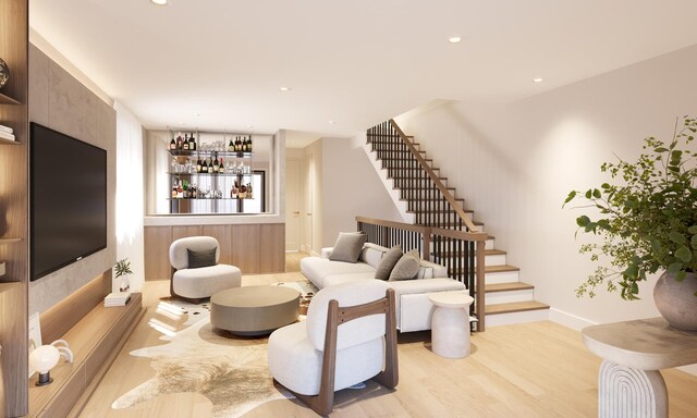 529 N Hartland Ct, Chicago, IL 60622 - living room with light wood-style floors, stairs, recessed lighting, and a bar