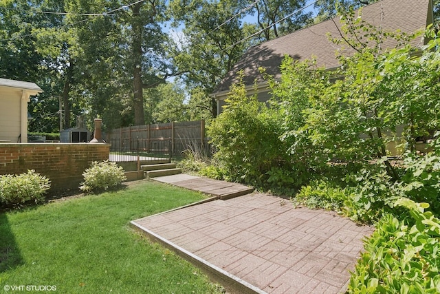 view of yard with a patio and fence