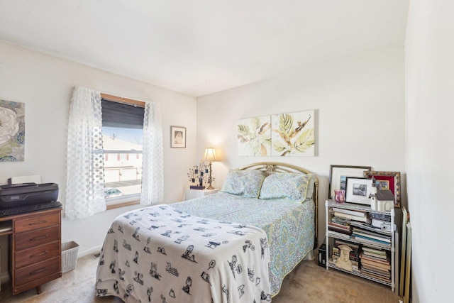 bedroom featuring light carpet