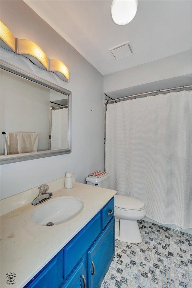 full bathroom with visible vents, toilet, and vanity