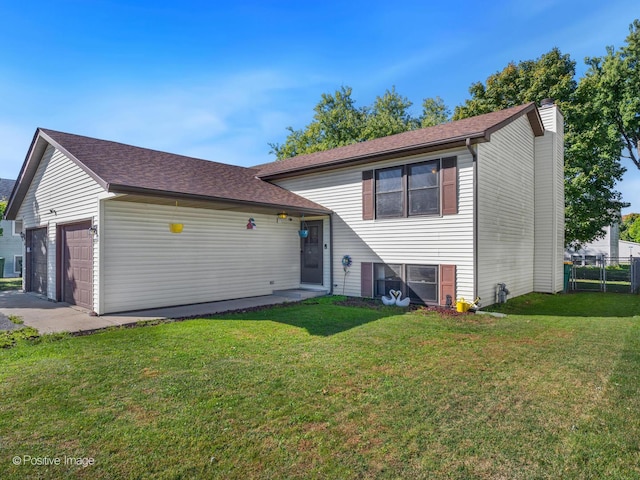 644 Swan Dr, Grayslake, IL 60030 - split level home with a chimney, a front lawn, a garage, and fence