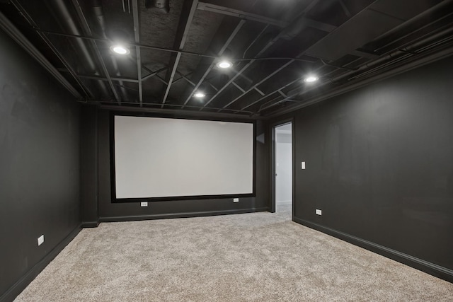 home theater room featuring carpet and baseboards