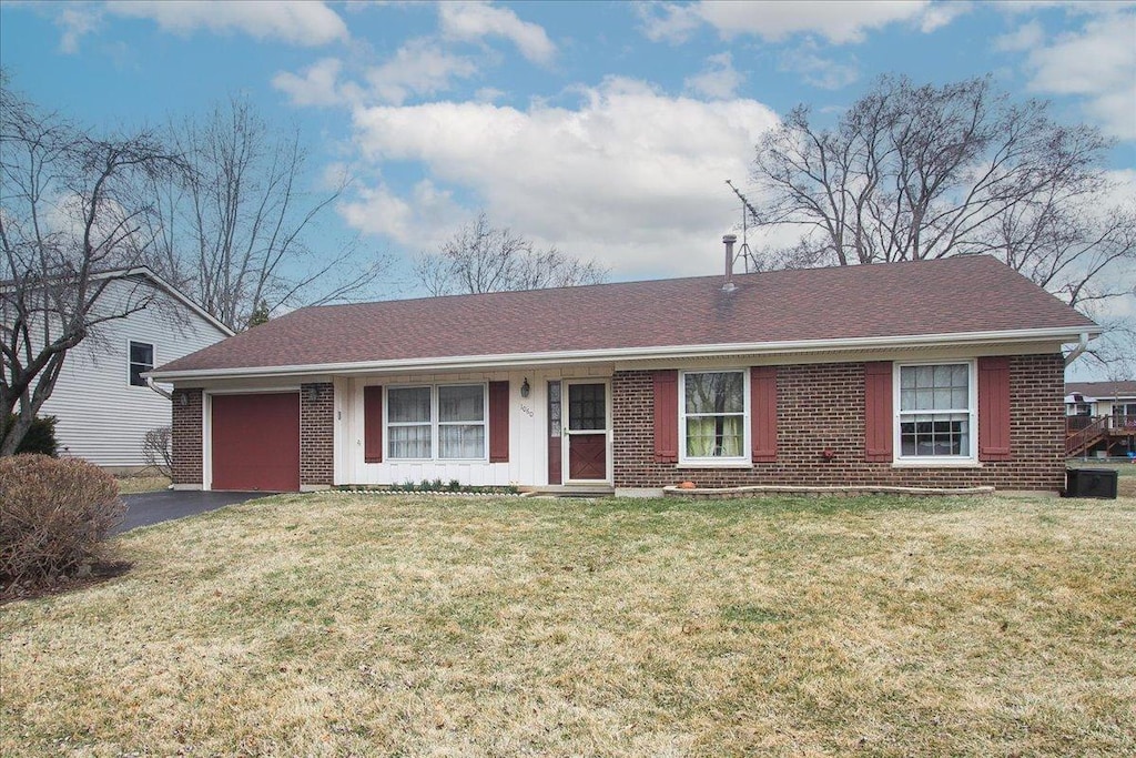 1060 Browning Ln, Lake Zurich, IL 60047 - ranch-style home featuring a front yard, brick siding, aphalt driveway, a shingled roof, and a garage