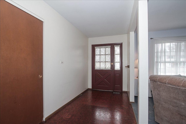 foyer entrance with baseboards
