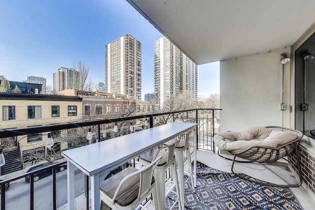 balcony featuring a view of city