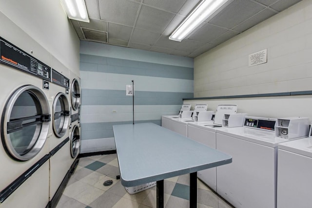 common laundry area featuring visible vents, washer and dryer, and light floors
