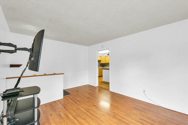 504 N 4th St, Saint Joseph, IL 61873 - unfurnished living room with light wood-style flooring
