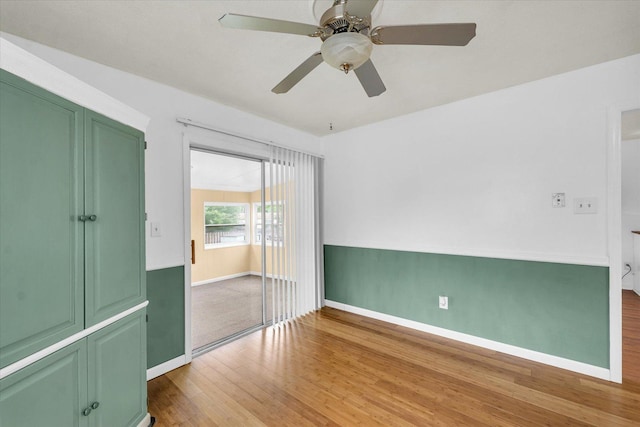 504 N 4th St, Saint Joseph, IL 61873 - unfurnished bedroom with wood finished floors, baseboards, and ceiling fan
