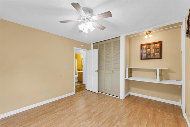 504 N 4th St, Saint Joseph, IL 61873 - unfurnished bedroom with light wood finished floors, a closet, baseboards, and a ceiling fan