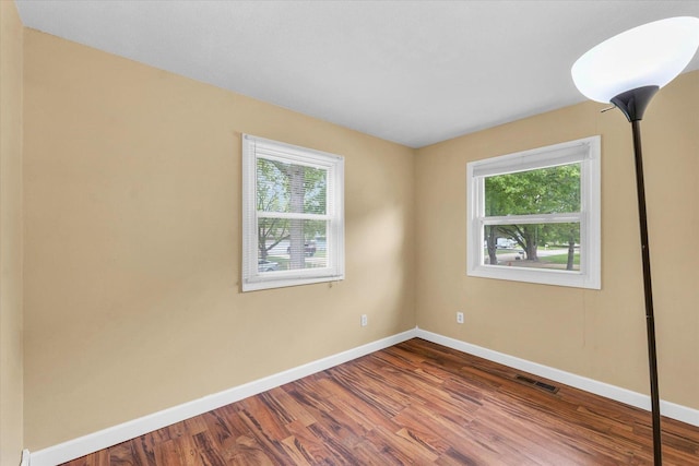 504 N 4th St, Saint Joseph, IL 61873 - unfurnished room with plenty of natural light, baseboards, and wood finished floors