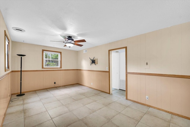 504 N 4th St, Saint Joseph, IL 61873 - unfurnished room featuring ceiling fan, baseboards, and wooden walls